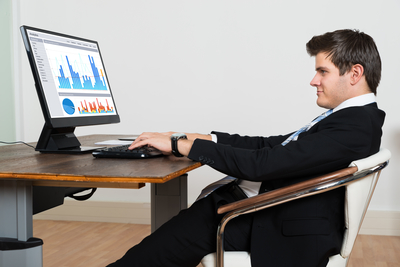 man working in office with bad posture